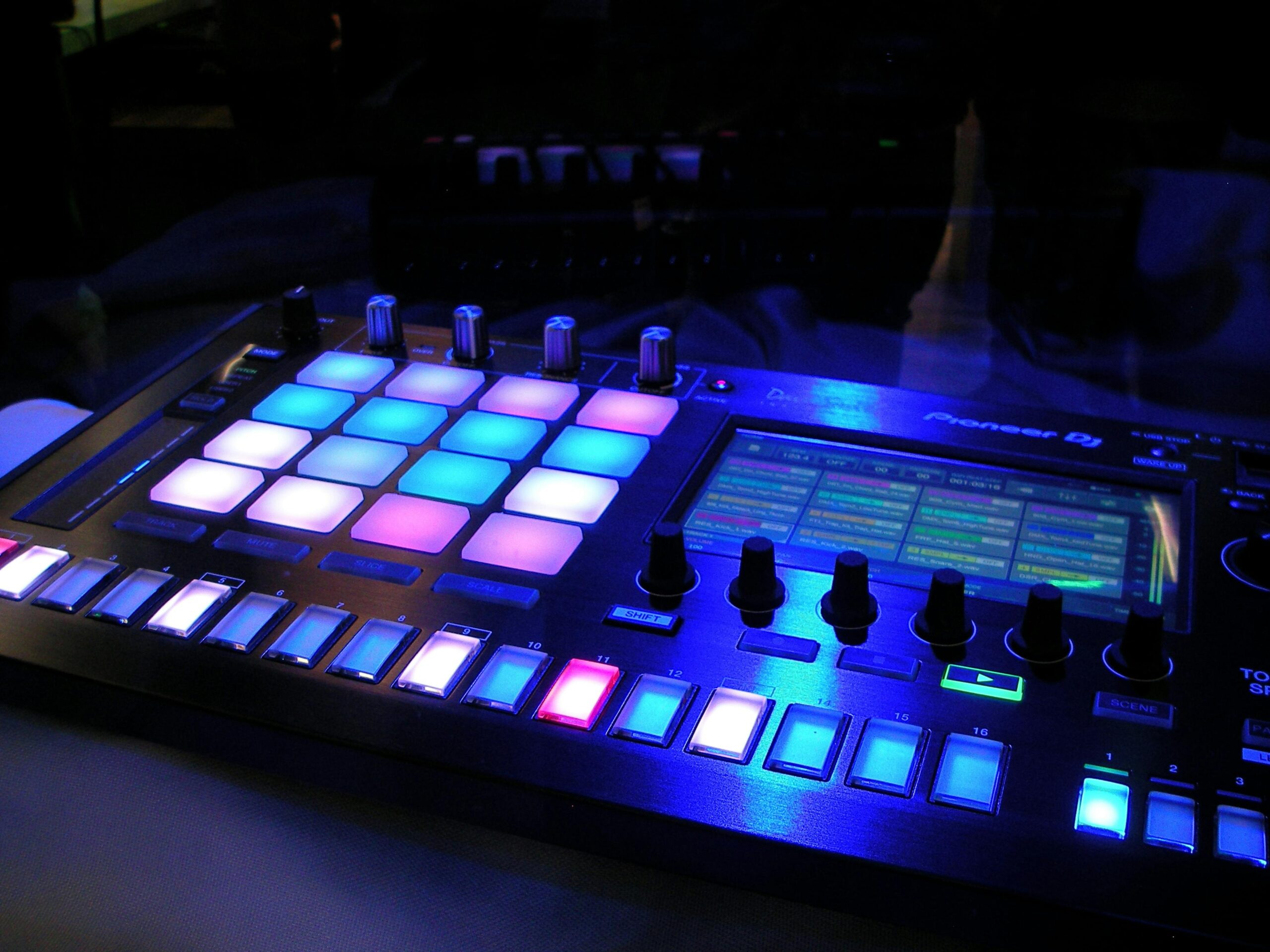 A DJ performing live, skillfully using a crossfader to blend two tracks seamlessly.